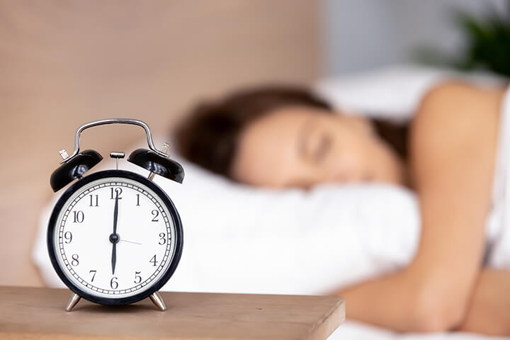 Woman Sleeping with Clock