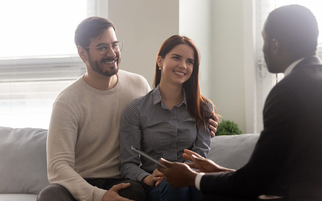 Couple discussing fertility treatment for baby number two with their doctor