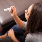 Woman viewing pregnancy test