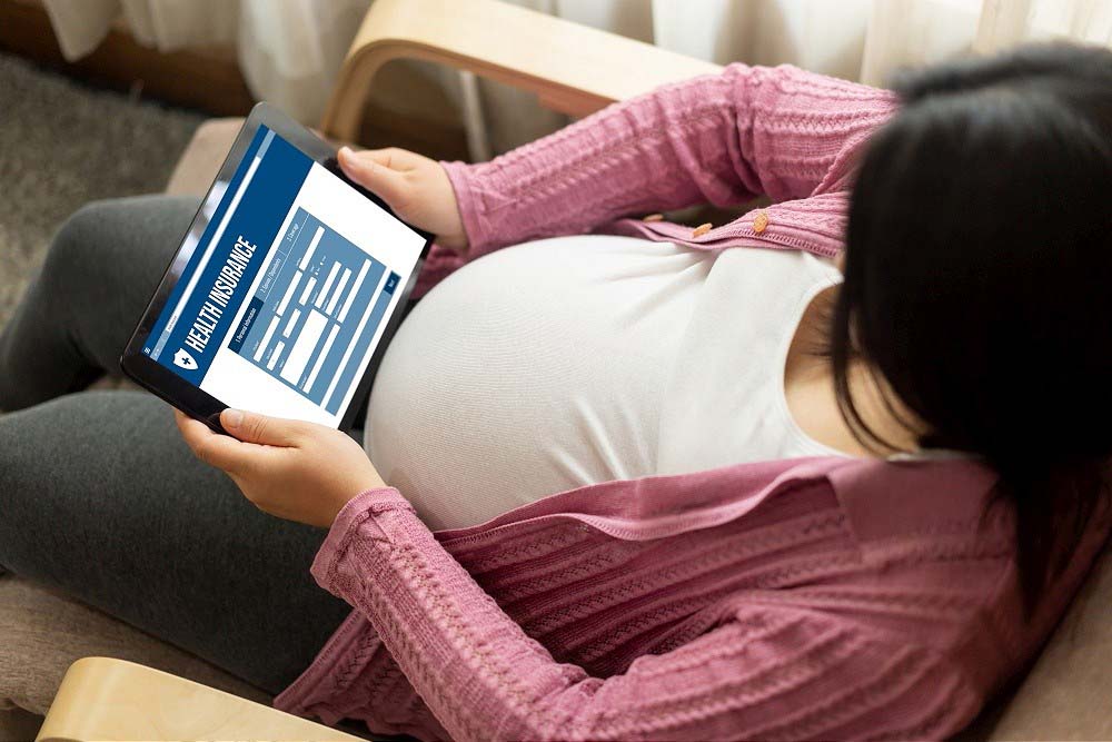 Pregnant woman enrolling in healthcare